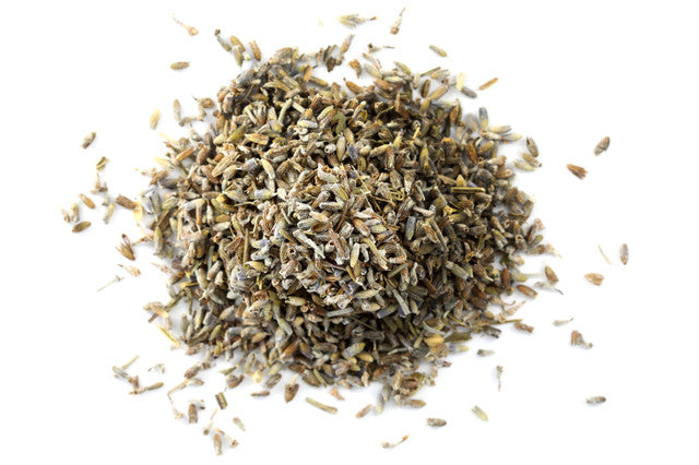 Top-down view of dried English lavender flowers by Healing Herbals, featuring small purple-gray buds with natural texture on a clean white background.