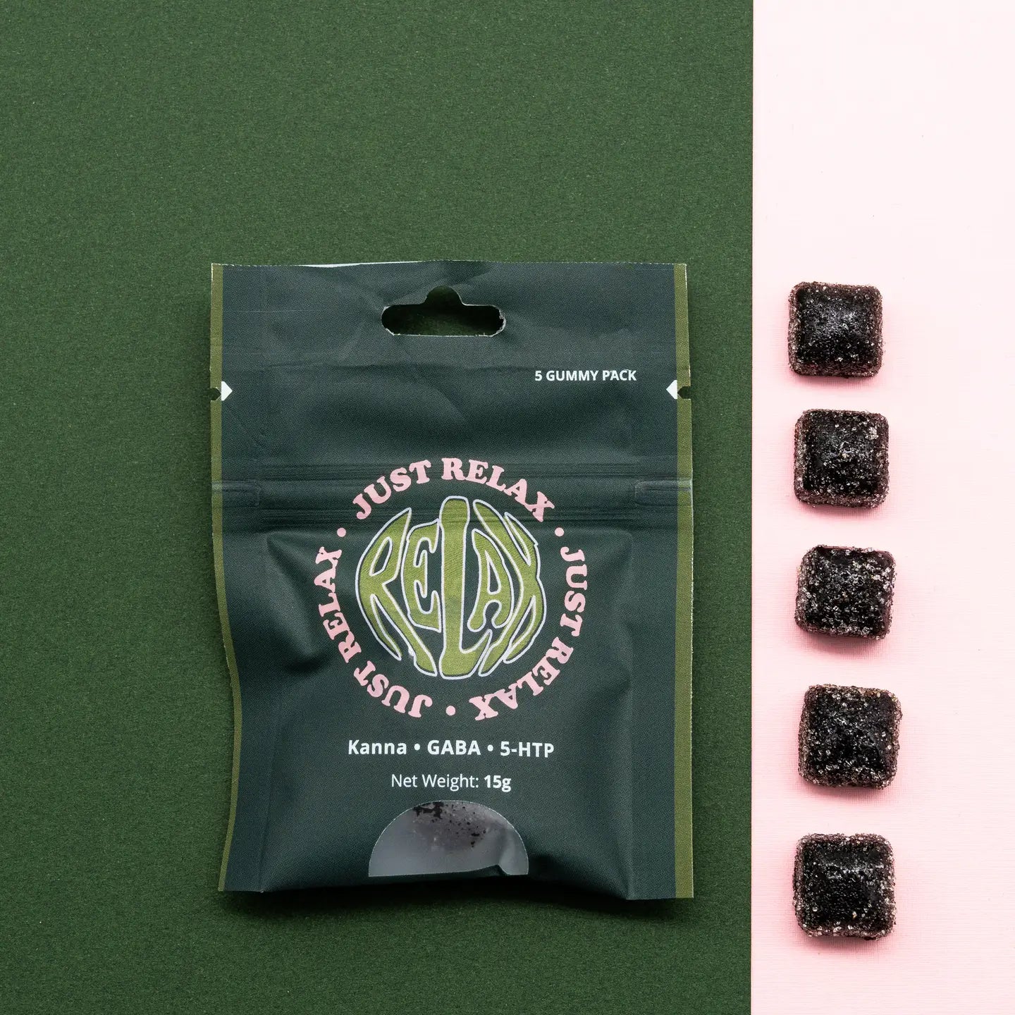 Just Relax Kanna Functional Chews by Healing Herbals in a dark green resealable pouch labeled “Kanna • GABA • 5-HTP,” 5-gummy pack (15g), photographed top-down on a deep green background with a vertical row of dark square gummies on a soft pink backdrop.