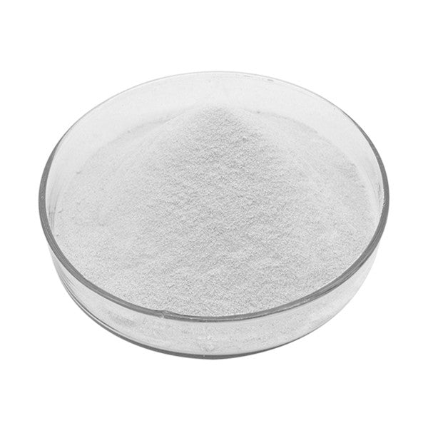 Clear glass bowl with white powder on a white background
