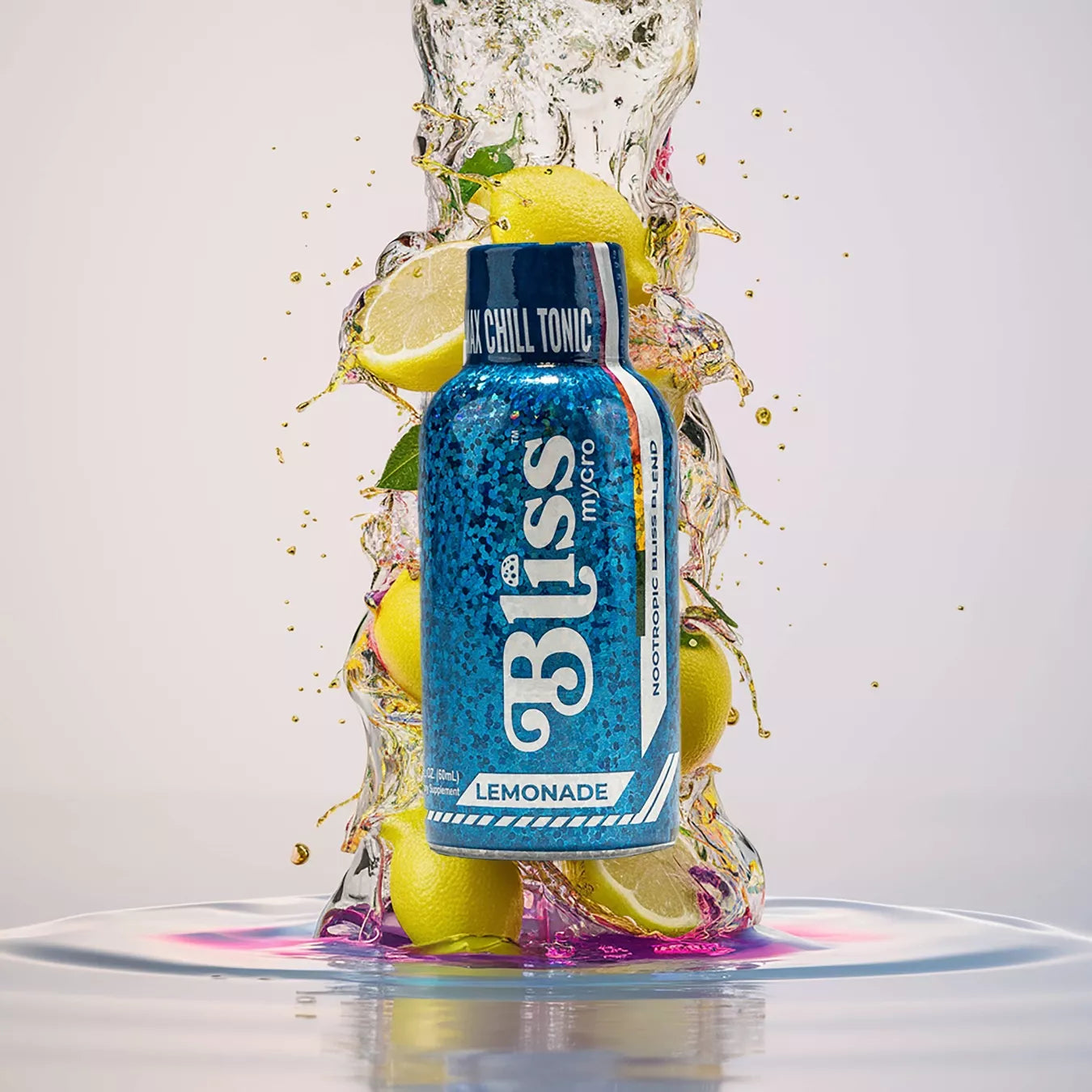 Nootropic beverage bottle with blue label, displayed with whole and sliced lemons and dynamic water splash effects.