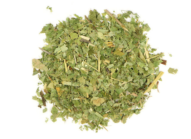 Top-down view of dried horny goat weed by Healing Herbals, showing chopped green leaves and stems with a natural, leafy texture on a clean white background.