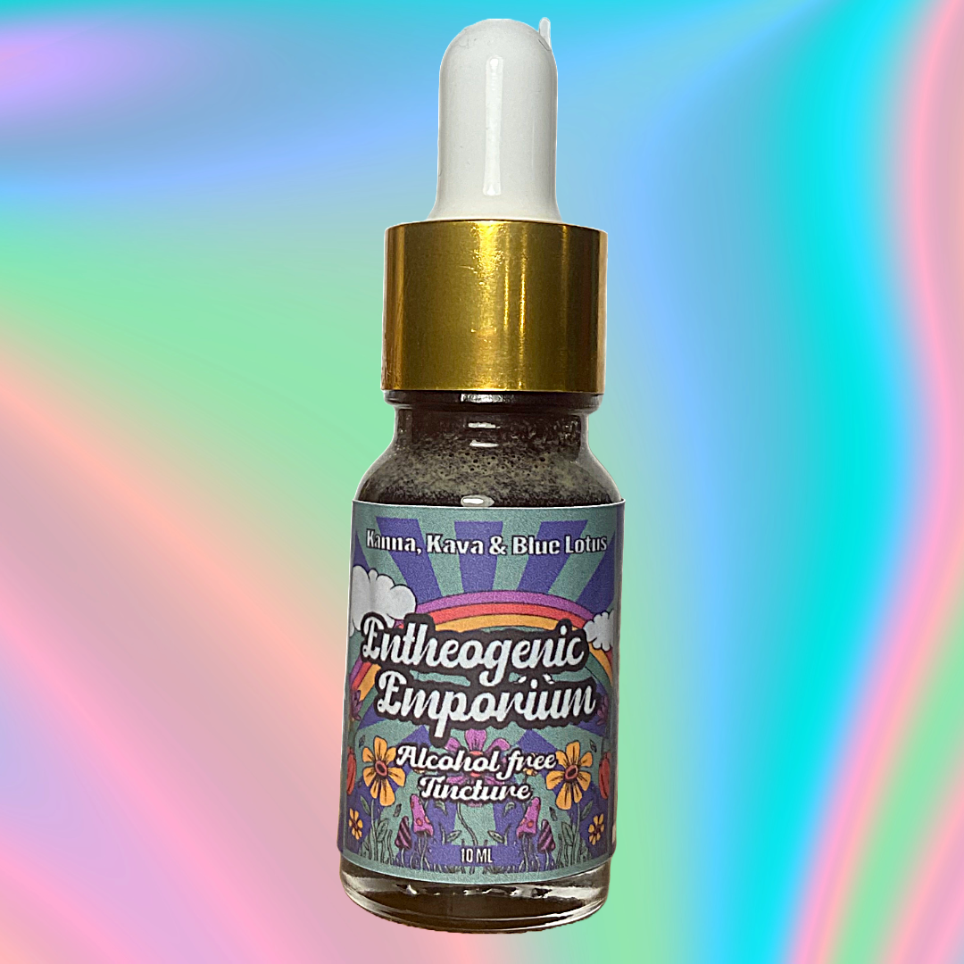 Alcohol-free herbal tincture bottle featuring Kanna, Kava, and Blue Lotus by Entheogenic Emporium, 10 ml glass dropper bottle with gold cap and colorful psychedelic label on a soft rainbow gradient background.