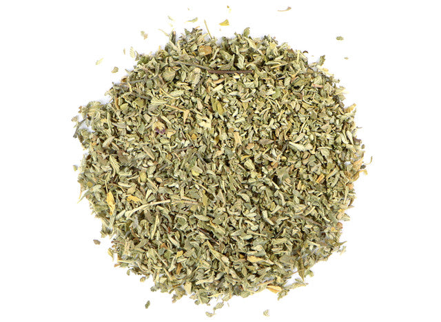 Top-down view of organic dried damiana leaf by Healing Herbals, showing finely cut green leaf pieces with natural texture on a clean white background.