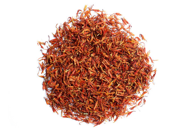 Top-down view of dried safflower petals by Healing Herbals, displaying vibrant red-orange strands with a delicate, fibrous texture on a clean white background.