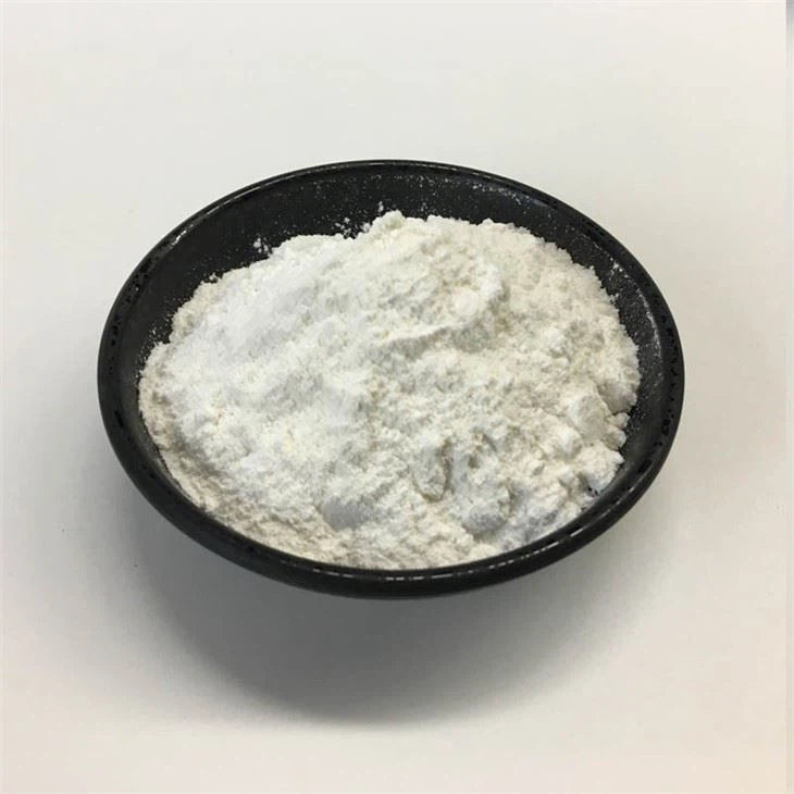 Open black container showing fine white powder inside.