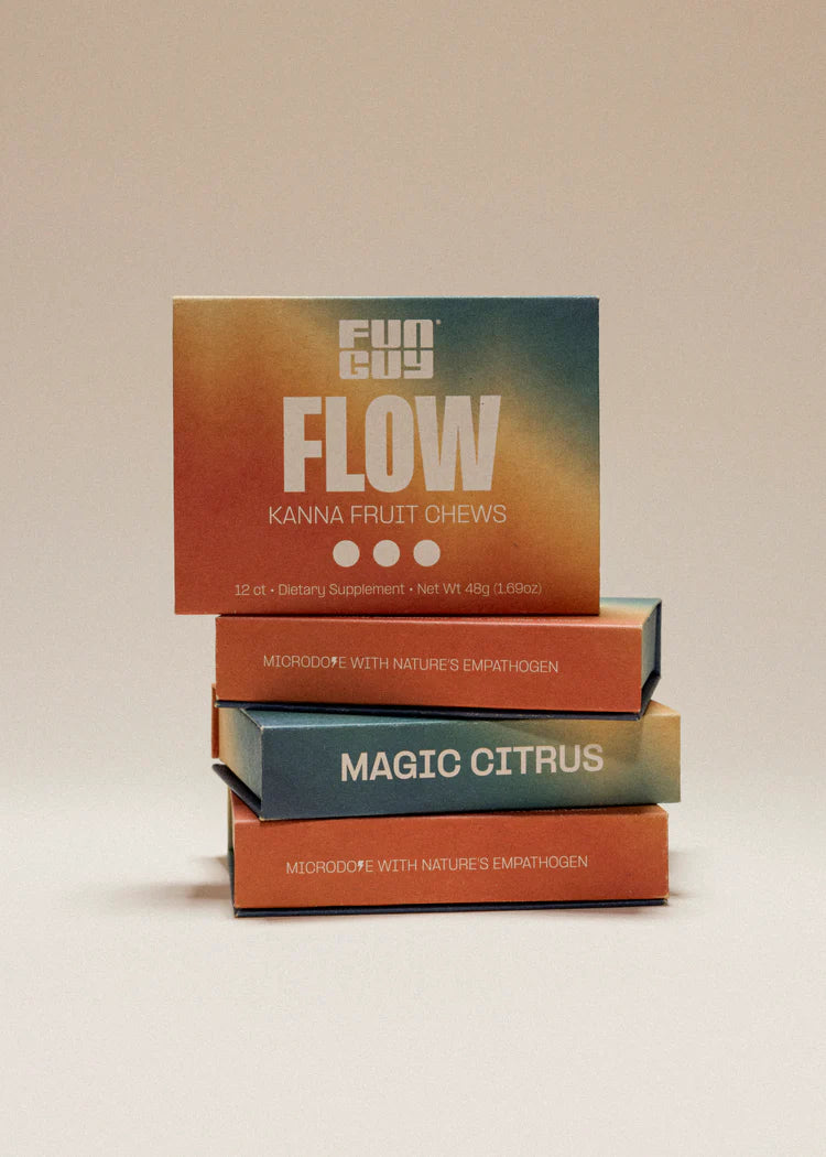 Four stacked colorful boxes on a neutral background, with one front-facing box labeled ‘Funguy Flow Kanna Fruit Chews’.